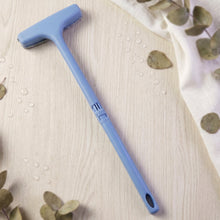 The soft bristles of the window mesh cleaner gently cleaning delicate screen surfaces.