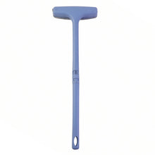 Side view highlighting the versatile brush, scraper, and cleaning pad features of the tool.