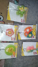 Multipurpose frog-shaped self-adhesive wall hook enhancing bathroom organization.