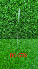 The 23cm long straw brush demonstrating flexible cleaning.