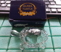 Decorative Feng Shui crystal turtle in a transparent finish, promoting peace.