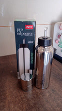 Full length stainless steel oil pourer with ergonomic and modern design