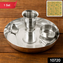 Traditional Indian meal served on a stainless steel thali set.