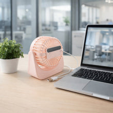 Portable silent small desk fan near a laptop for personal use