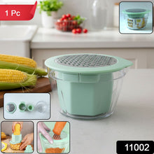 Handheld manual vegetable grater stripping corn kernels efficiently