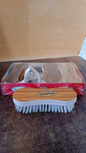 Detailed view of cleaning brush bristles with ergonomic grip for effective stain removal