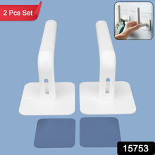 Close-up of the white hanging storage rack showing its drain holes and capacity for small items like sponges or toiletries.