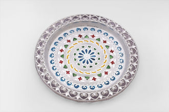 Decorative silver plated pooja thali with a polished finish, reflecting cultural heritage.