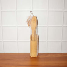 Natural bamboo cooking spatula set styled on kitchen counter