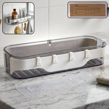 Modern transparent bathroom wall shelf with white accents and three hooks for accessories