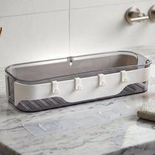 Wall-mounted transparent bathroom storage shelf with hooks for towels and toiletries
