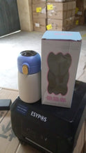 Detailed view of the smart water bottle's LED display and ergonomic design.