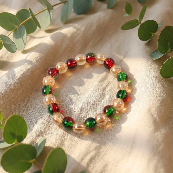 Multicolor glossy bead stretch bracelet showcasing vibrant red, green and golden beads
