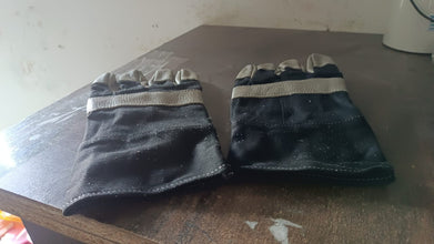 Person using BraveVault leather gloves for various outdoor tasks.