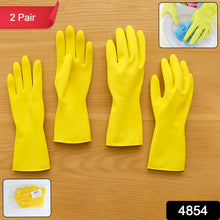 Anti-slip texture on the palm of yellow rubber cleaning gloves for secure grip.