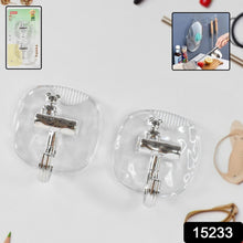 Plastic heavy-duty self adhesive wall hook holding keys and towel