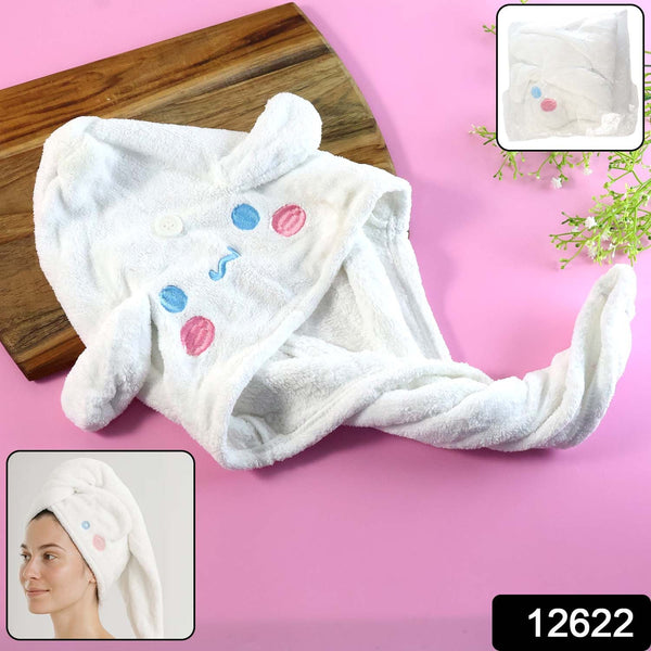 Close-up of hair wrap towel cap showing button closure and cartoon embroidery