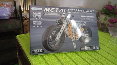 Kids enjoying the challenge of assembling the metal bike building blocks.