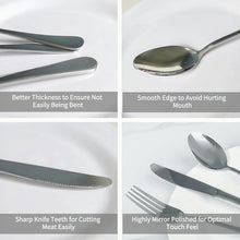 Complete polished stainless steel cutlery laid out on dining table