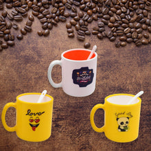 Elegant designer coffee mug with spoon, presented in a gift box.