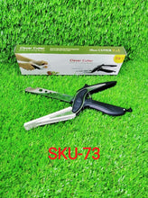 Versatile clever cutter in black, highlighting its food-grade stainless steel construction.