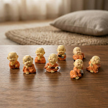 Variety of Mini Monk Buddha figurines in different poses for spiritual ambiance