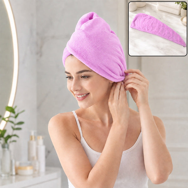 A smiling woman in a white tank top wears a purple microfiber hair wrap, securing it above her ear. 