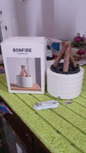 Flame Diffuser creating a warm ambiance on a bedside table with soft lighting.