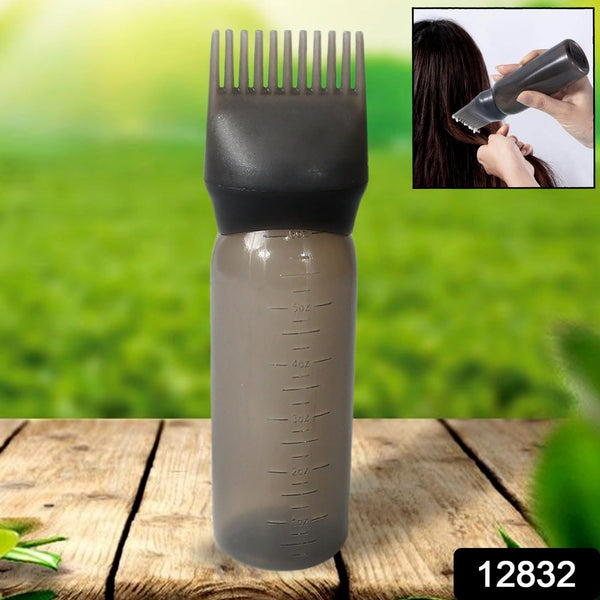 Close-up of the comb applicator brush and pump handle, showing fine bristles.