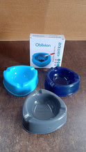 Angled view of plastic ashtray on wooden table