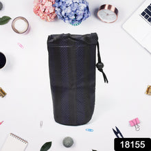 A navy blue drawstring pouch with vertical stripes stands upright on a white surface surrounded by office supplies and