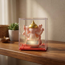 Alternate angle of hand-moving small Ganesha idol with vibrant finish