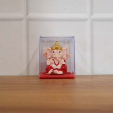 Back view of small red and gold Ganesha decorative statue