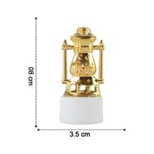 Hand holding a flameless LED tealight to illustrate its compact size.