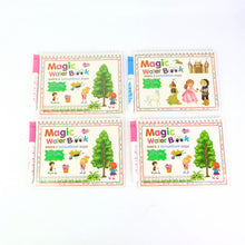 Child’s hand revealing colours on magic water activity book with water pen