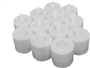 Several LED tealight candles illuminating a dark setting, showing their warm glow.