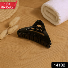 Close-up image of durable plastic triangle hair claw clip with spring mechanism