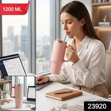 Pink stainless steel tumbler with carry handle and straw