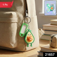 Close-up of cartoon character keychain charm with ID tag and metal key ring