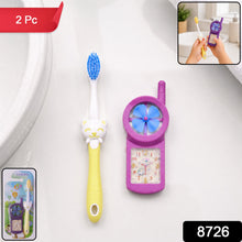 Close-up of a blue kids cartoon toothbrush with soft bristles and fan toy