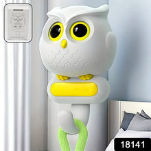 Set of two self adhesive bird hooks mounted on a wall, showcasing their decorative appeal.
