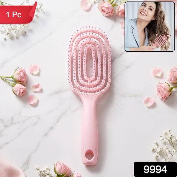 Pink detangling hair brush in packaging, suitable for all hair types