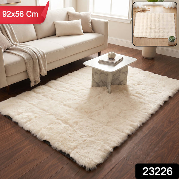 A cream fluffy faux fur rug on a wooden floor, with a red banner indicating 92x56 cm dimensions.