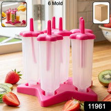Close-up of BPA-free plastic popsicle molds filled with juice ready to freeze