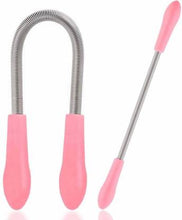 A woman holding the portable spring facial hair remover, ready for use.