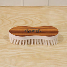 Close-up of cloth washing brush with nylon bristles and ergonomic grip