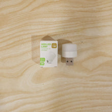 USB LED night light shining warm glow in a dark room