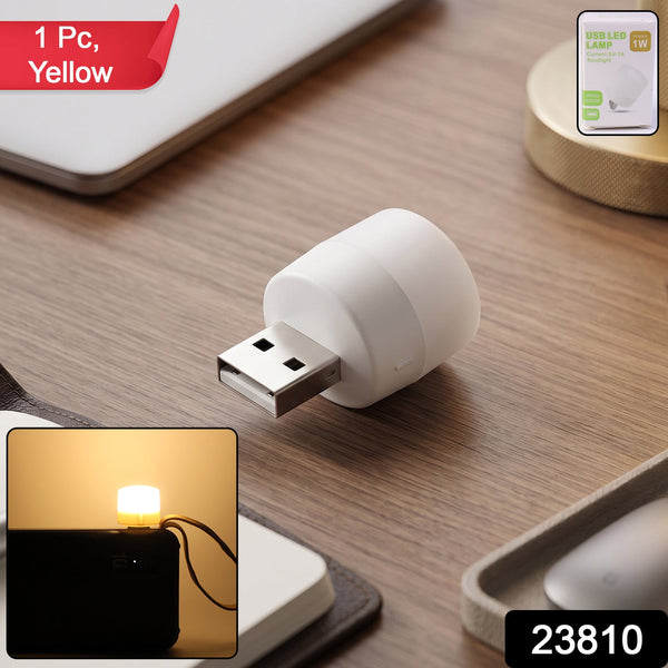 Compact yellow USB LED lamp with packaging showing product branding
